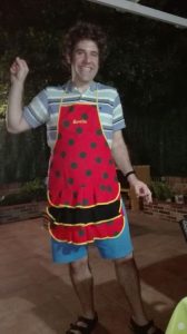 Doer in the customary apron all guests in his Spanish family's home are required to wear