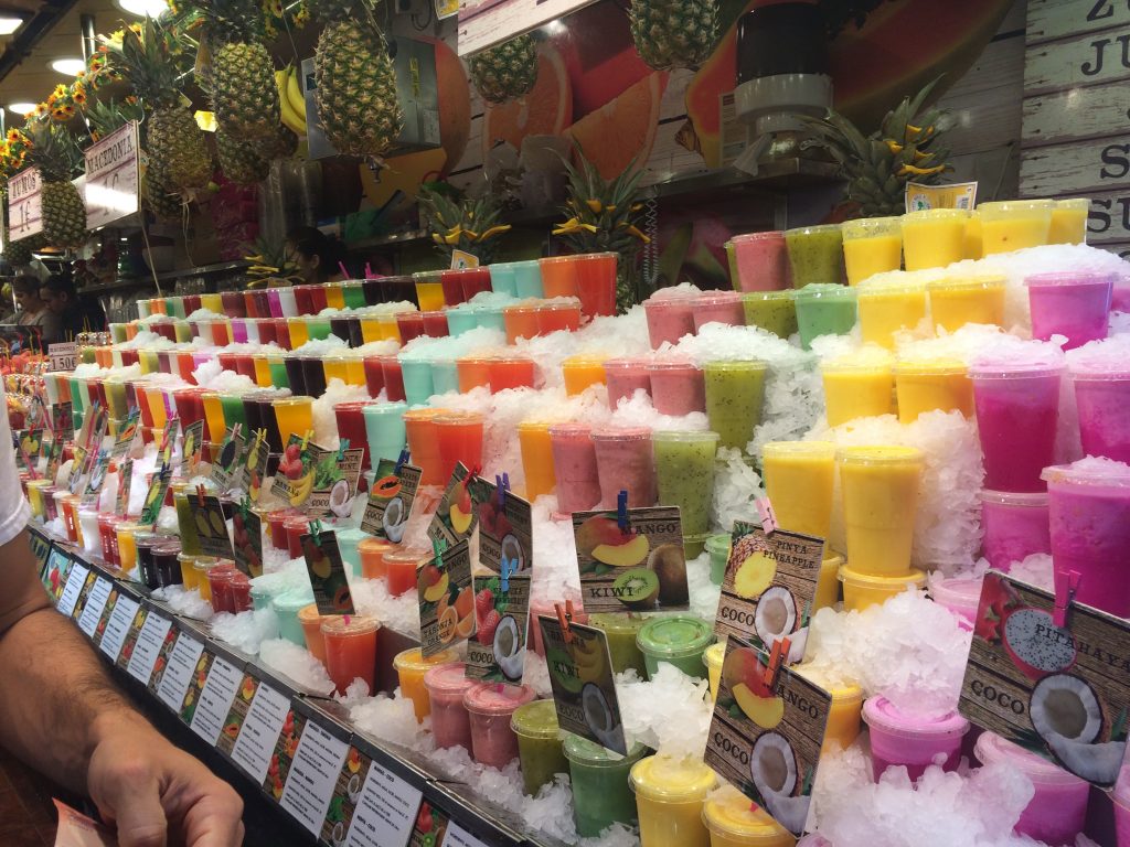 Colorful display of fresh juices and smoothies.